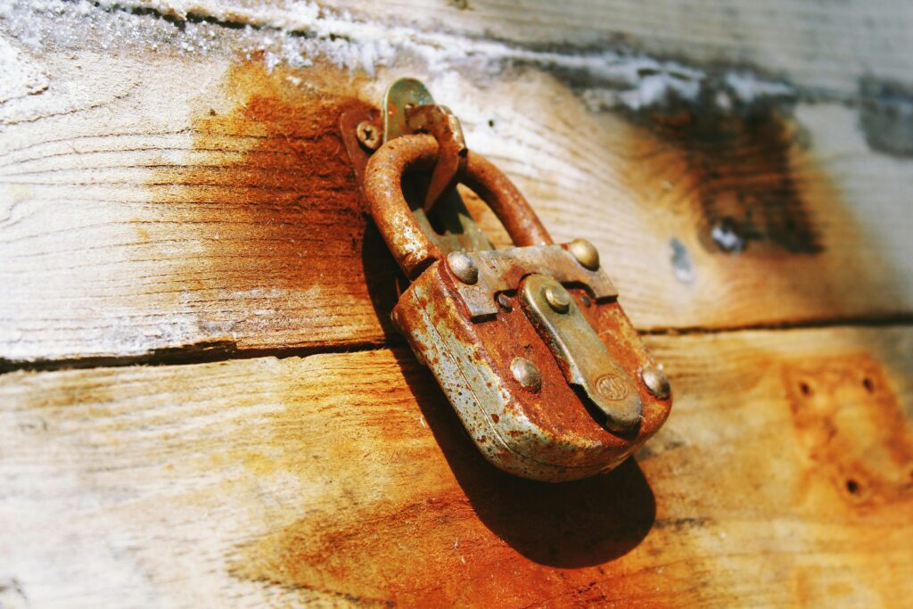 Picture of a lock on a plank of wood