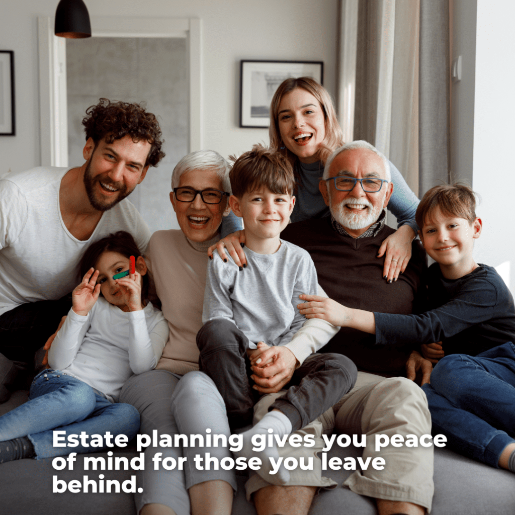 Family sitting together on a couch, smiling. 