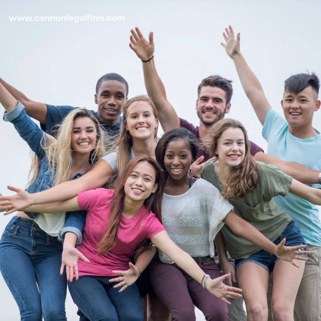 bunch of young adults posing happily 