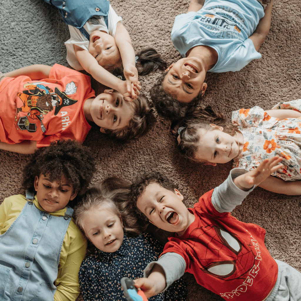 Children laying in a circle