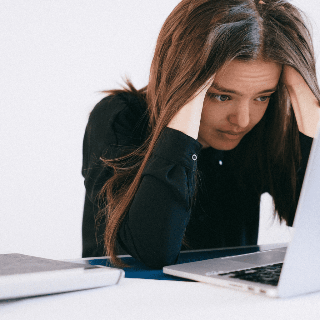 frustrated woman looking at laptop