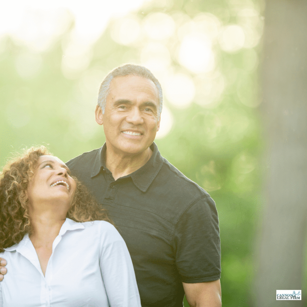 husband and wife embracing and smiling 