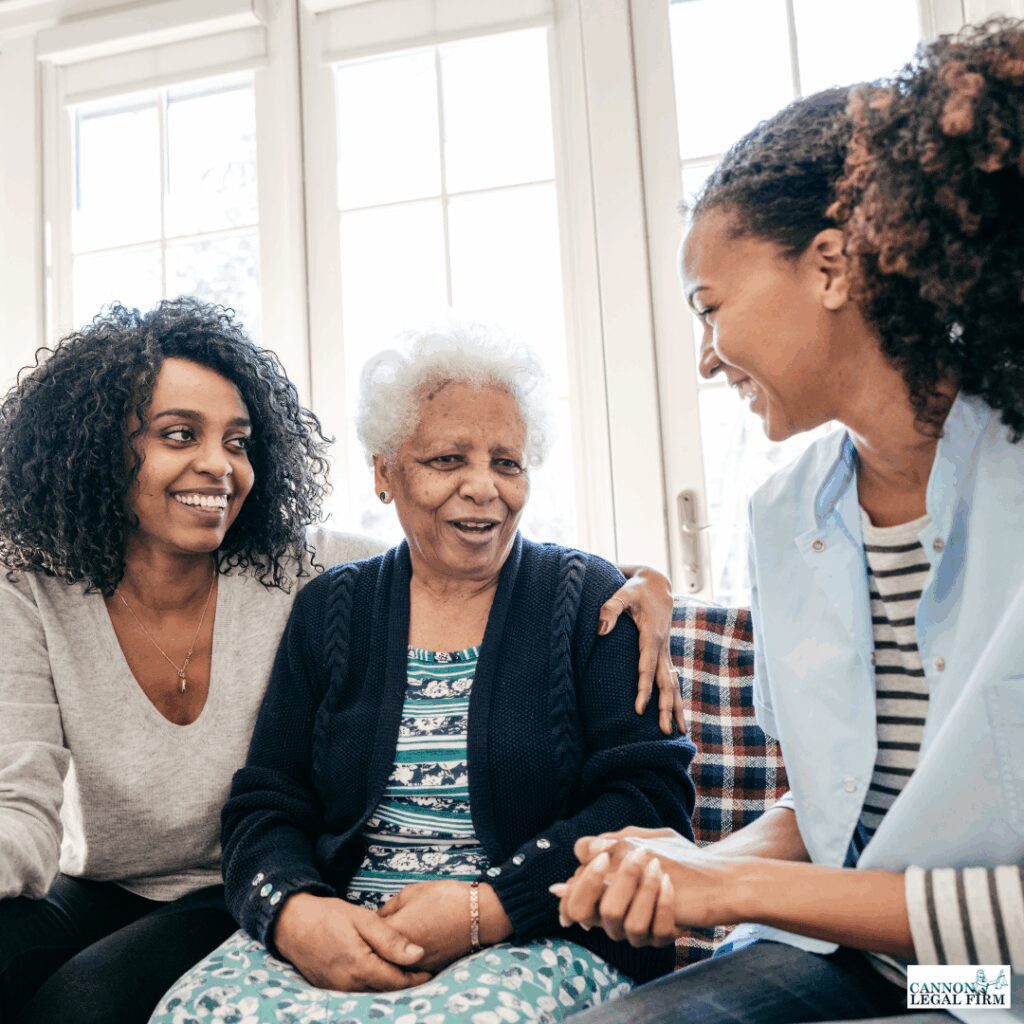 Assisted living. Elderly woman sitting in between two younger  women. 
