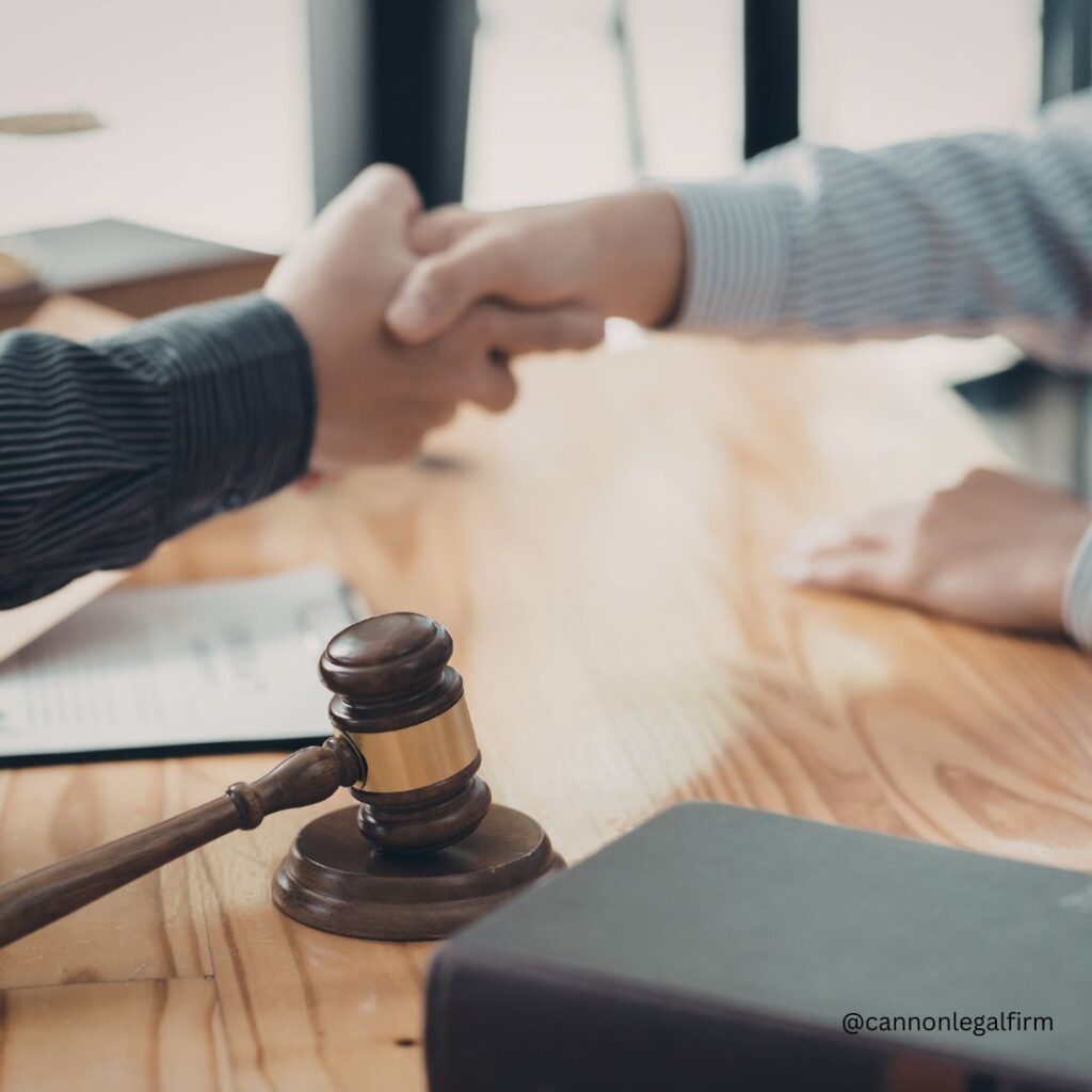 two people shaking hands, judges hammer on a table
